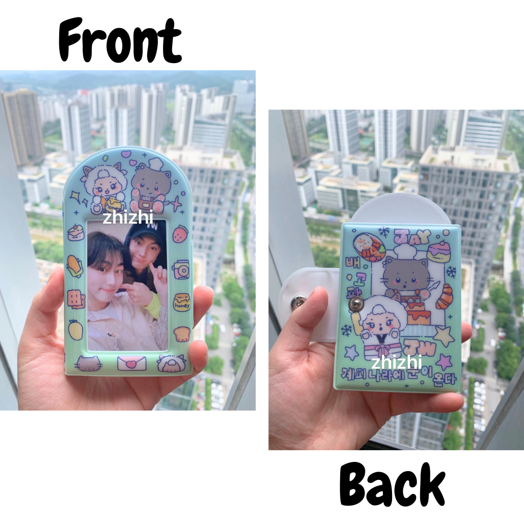 A pastel green photocard binder open on a flat surface, showcasing pockets filled with illustrated cards. The left side displays cute, cartoon-style drawings labeled 'JAY' and 'Jungwon' with whimsical dessert motifs. The right side features a clear pocket with a photocard of ENHYPEN's Jungwon, overlaid with playful graphics. The words "ENHYPEN PC Binder" are emblazoned across the top in bold, with "JAY x JUNGWON" beneath, indicating a special collaboration.