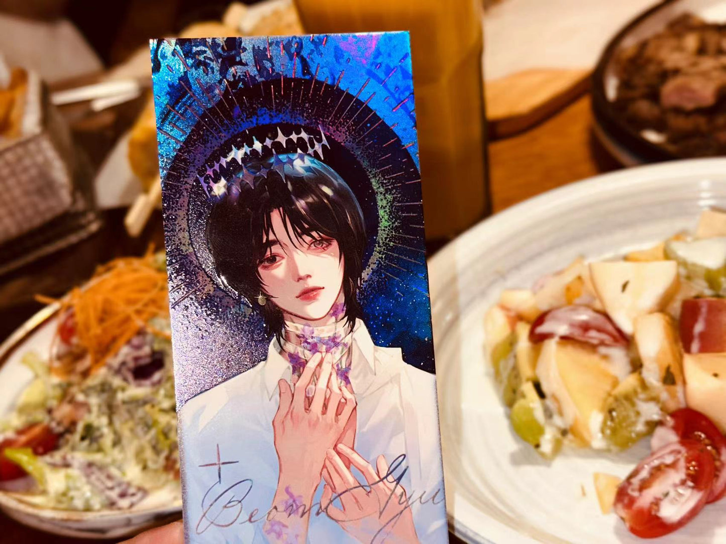 a woman sitting at a table with a plate of food 